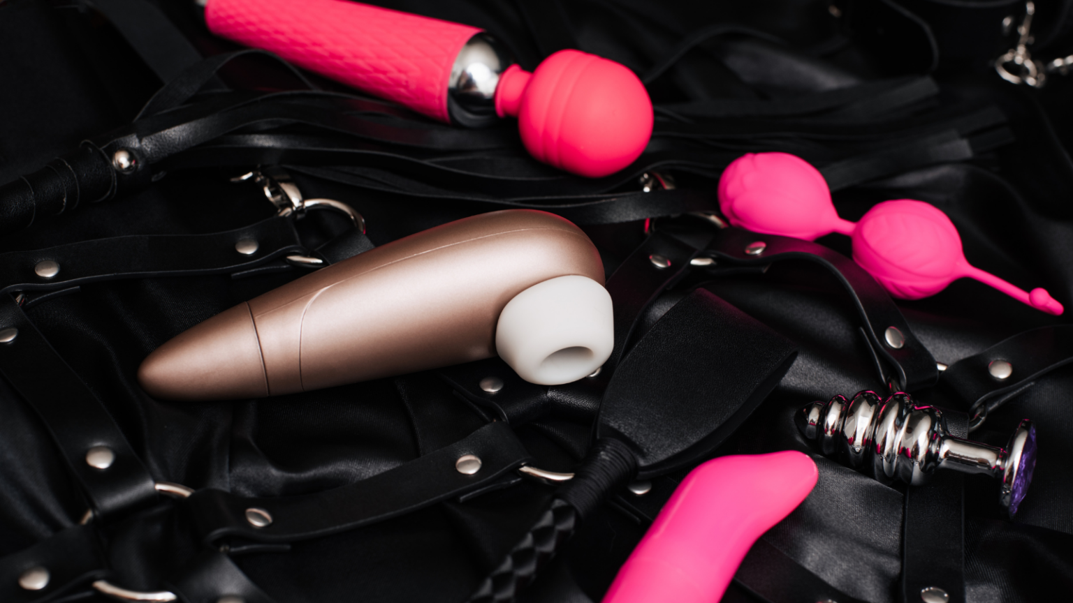 Black woman points and laughs at white man with spiked hair, who is smiling back at her